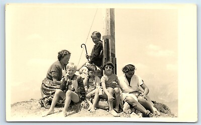 #ad Postcard Family with Kids sitting at base of Wooden Post RPPC J162 $7.97