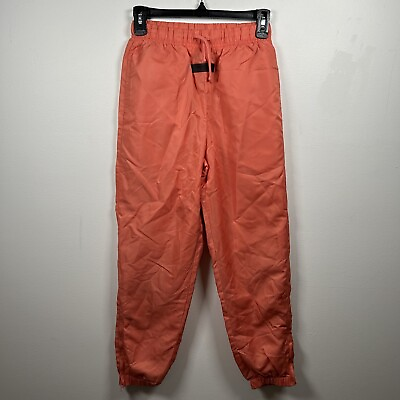 #ad Fear of God ESSENTIALS Kids Logo Nylon Pants in Coral Orange Size 10 $39.95