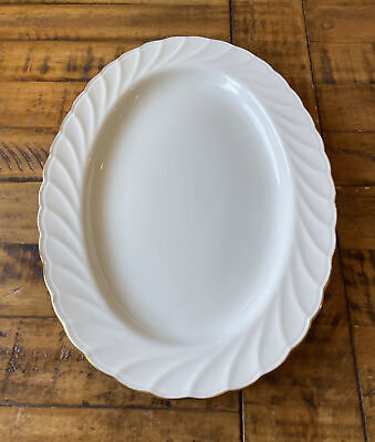#ad Oval White Serving Platter 14” Gold Trim. Finest porcelain. Golden Swirl. Indone $12.75